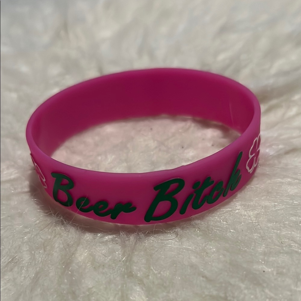 Pink Silicone Bracelet with Green Text